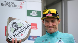 Rohan Dennis in Romandie lead after mountain slog