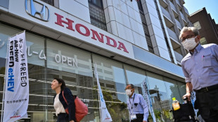 Honda posts record profit, issues cautious forecasts