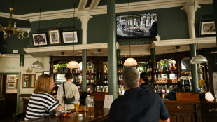 Shops shut for queen's funeral but pubs to raise glass