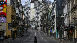 Guns, blasts and smiles in Kyiv under military curfew