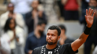 Tsonga says tearful farewell after French Open defeat