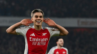 Arsenal fightback sinks Spurs to ignite title bid