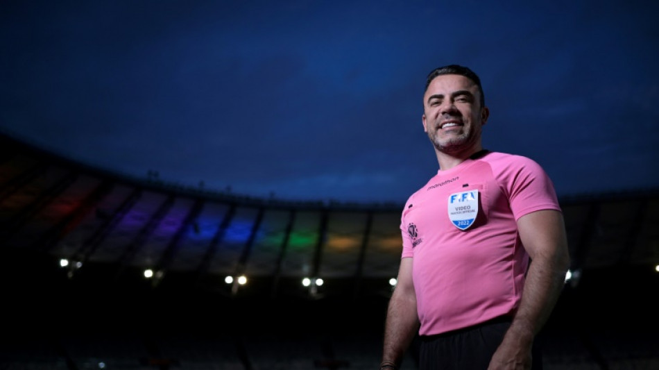 Removing 'camouflage,' Brazil football referee comes out