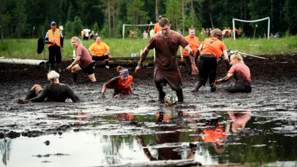 Swamp soccer world cup sees teams clash in knee-deep bog