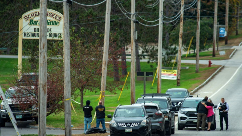 Police surround family home of 'armed and dangerous' US shooting suspect