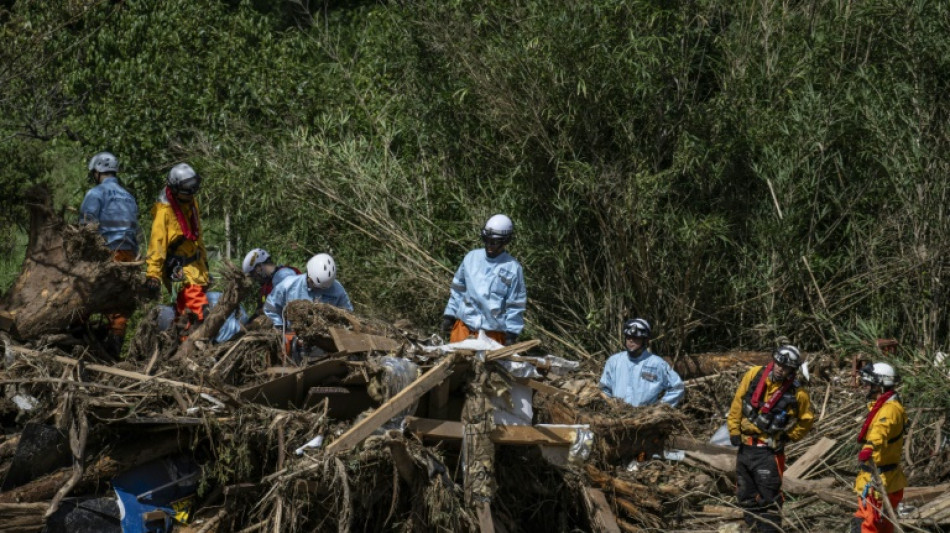 Rescuers comb muddy riverbanks after Japan floods kill seven