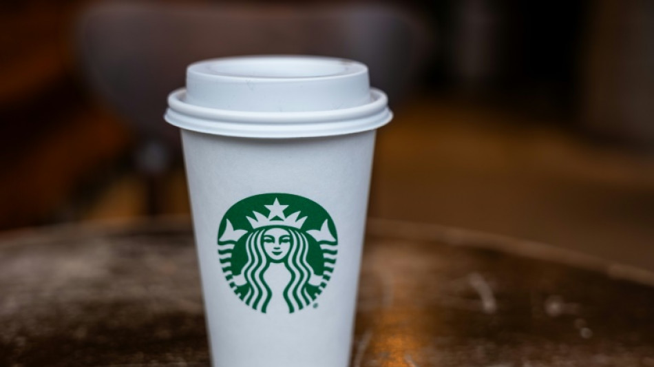 Starbucks points to weaker consumer as profit falls