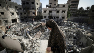 Gaza clears rubble, buries dead as truce with Israel holds