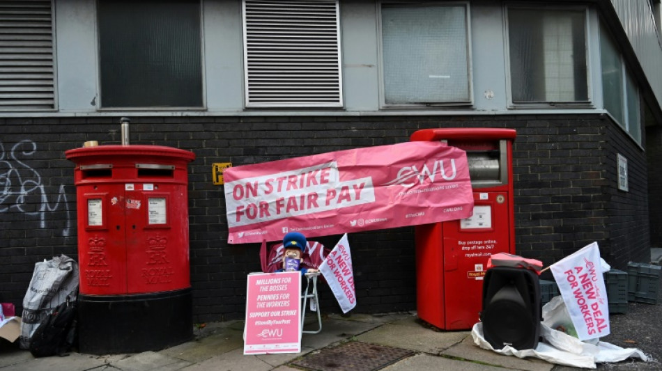 UK rail, postal staff halt strikes after queen's death