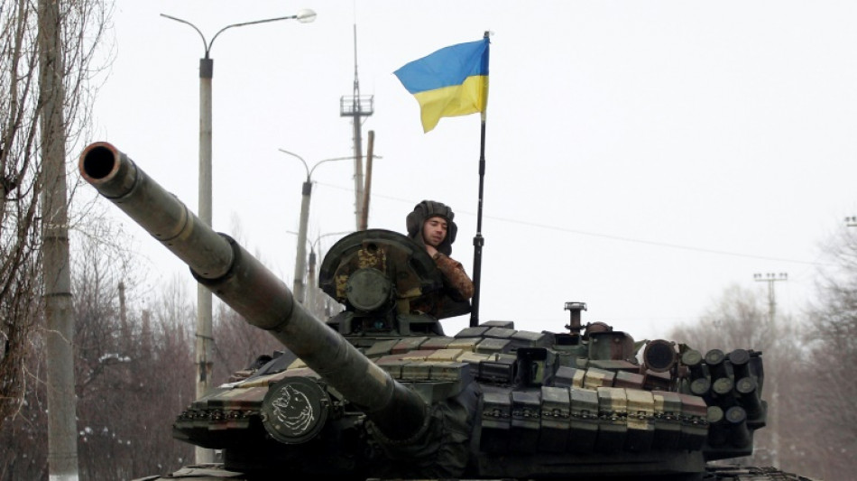 Ukraine: les forces russes encerclent Kiev et bloquent Marioupol