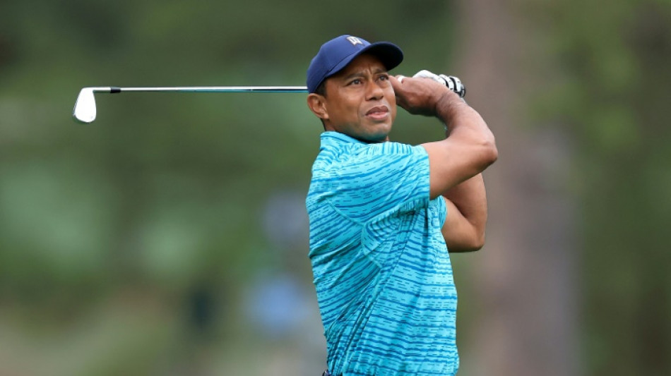 Tiger fights back to stay in the hunt at the Masters 