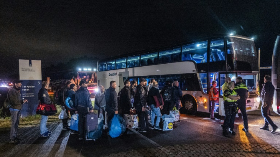 Dutch bus out asylum-seekers at crisis-hit centre 