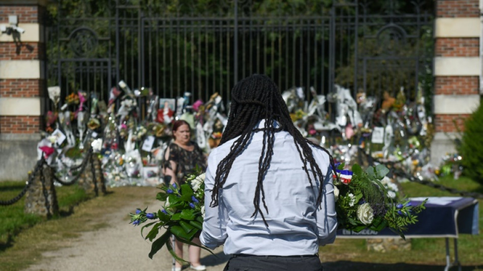 Fans mourn as film legend Delon is buried near his dogs