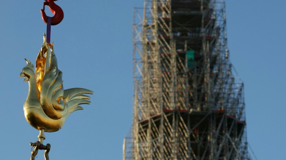 Golden rooster fitted to spire of Paris's Notre Dame cathedral