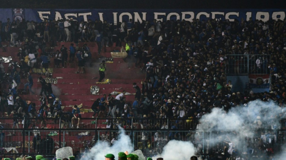 Indonesia court overturns acquittal of two policemen over stadium deaths